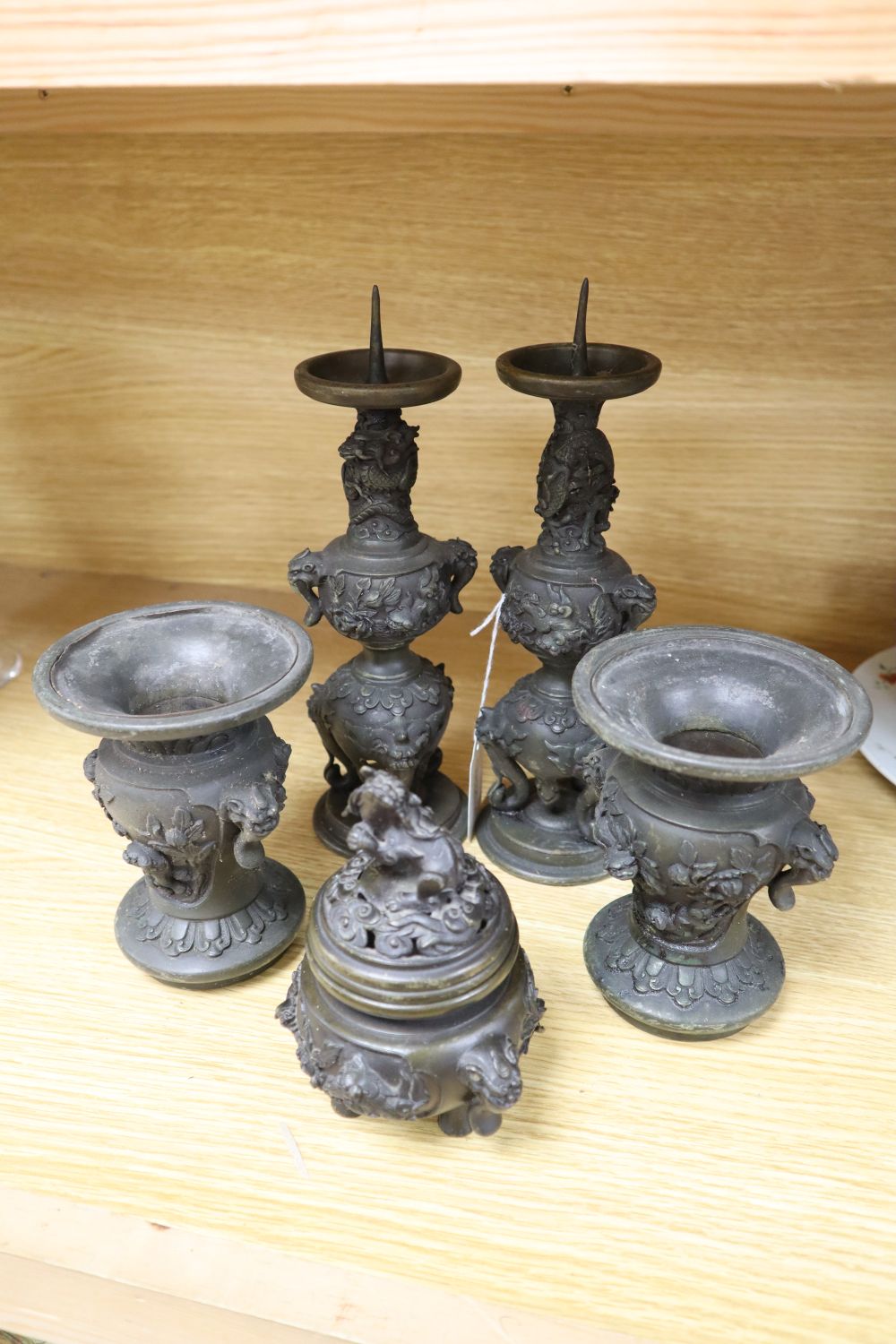 A five piece Japanese bronze altar set, tallest 25cm